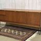 1970s English enfilade in teak with splayed legs.