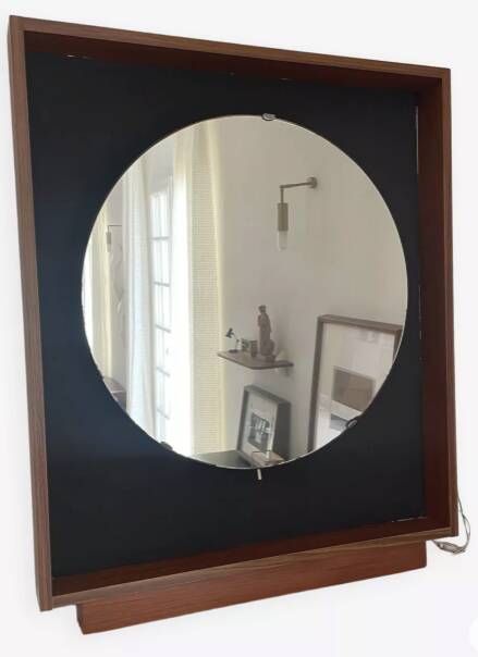 Scandinavian mirror with wooden frame and backlighting.