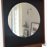 Scandinavian mirror with wooden frame and backlighting.