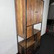 Antique wooden cabinet with black metal structure