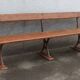 Old wooden bench with cast iron base