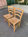 2 solid wood kitchen chairs with straw in a country style