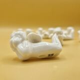 12 porte-couteaux vintage en porcelaine figurant des chérubins