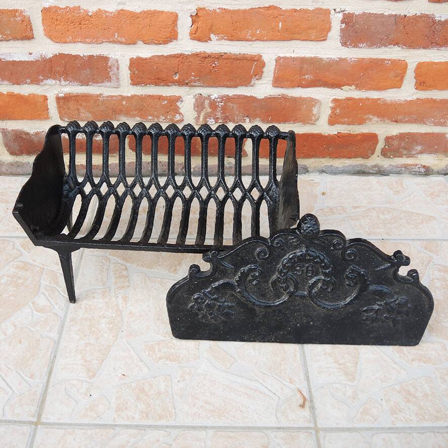 Old cast iron log cradle with backrest
