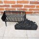 Old cast iron log cradle with backrest