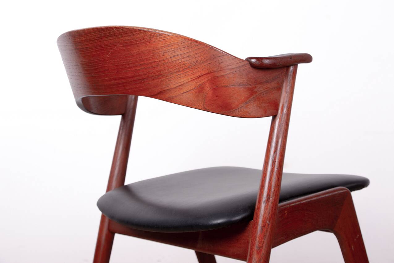 Danish armchair in teak and Skai, by Henning Kjaernulf for Korup Stolefabr.