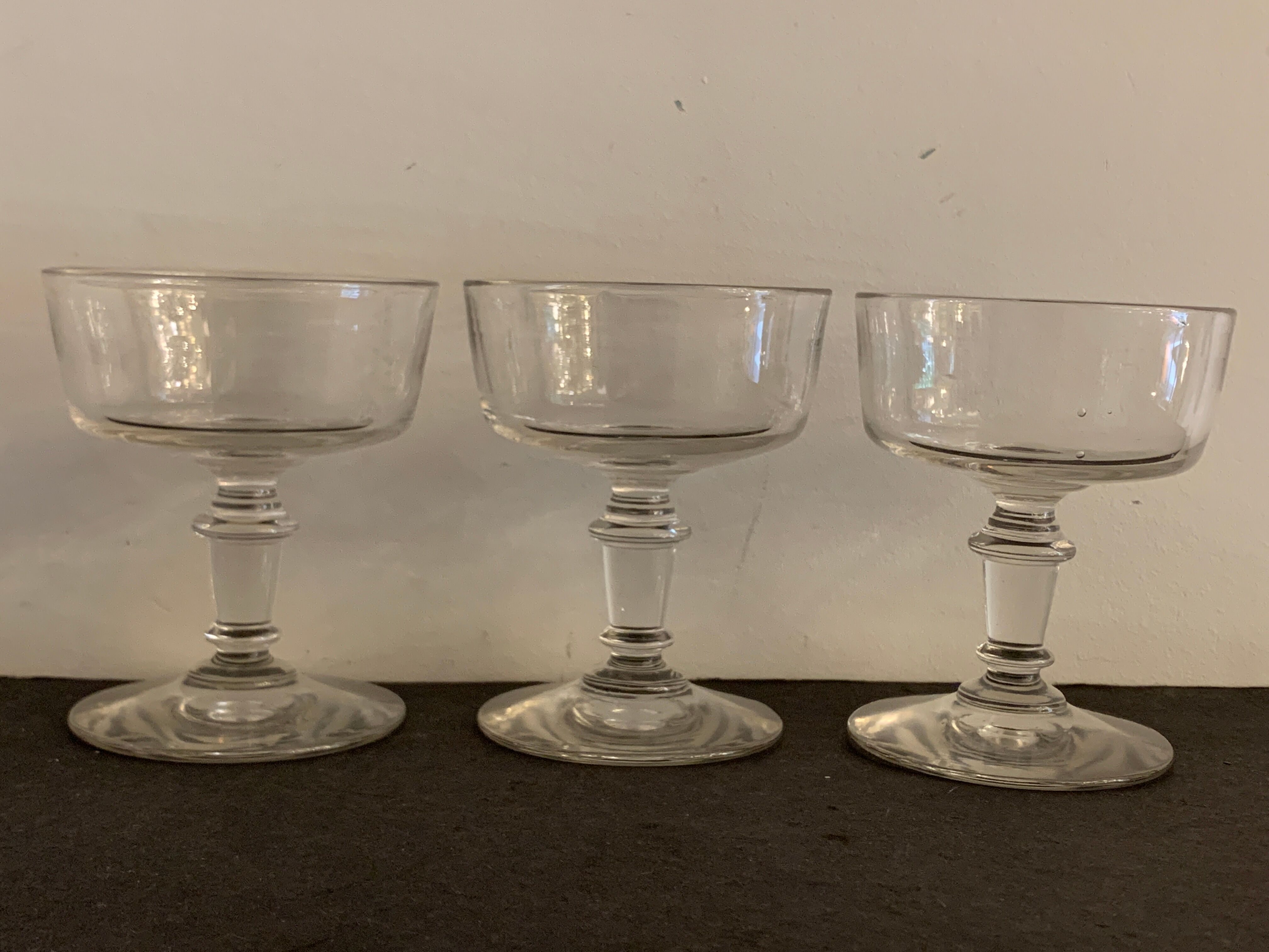 3 old champagne cups in blown and bubbled glass