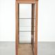 Antique Dutch oak display cabinet with glass shelves and a mirrored back