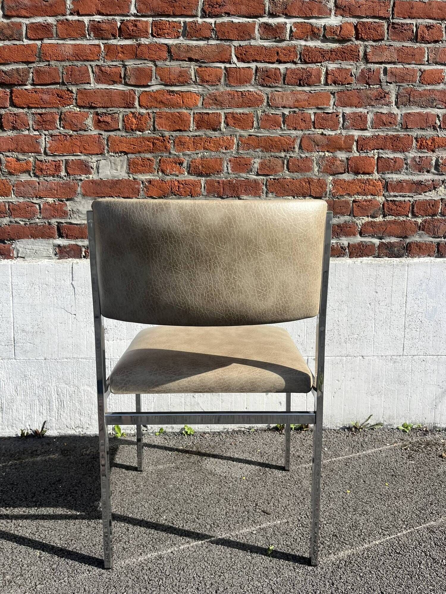 Set of 4 vintage chairs in chrome and faux leather.