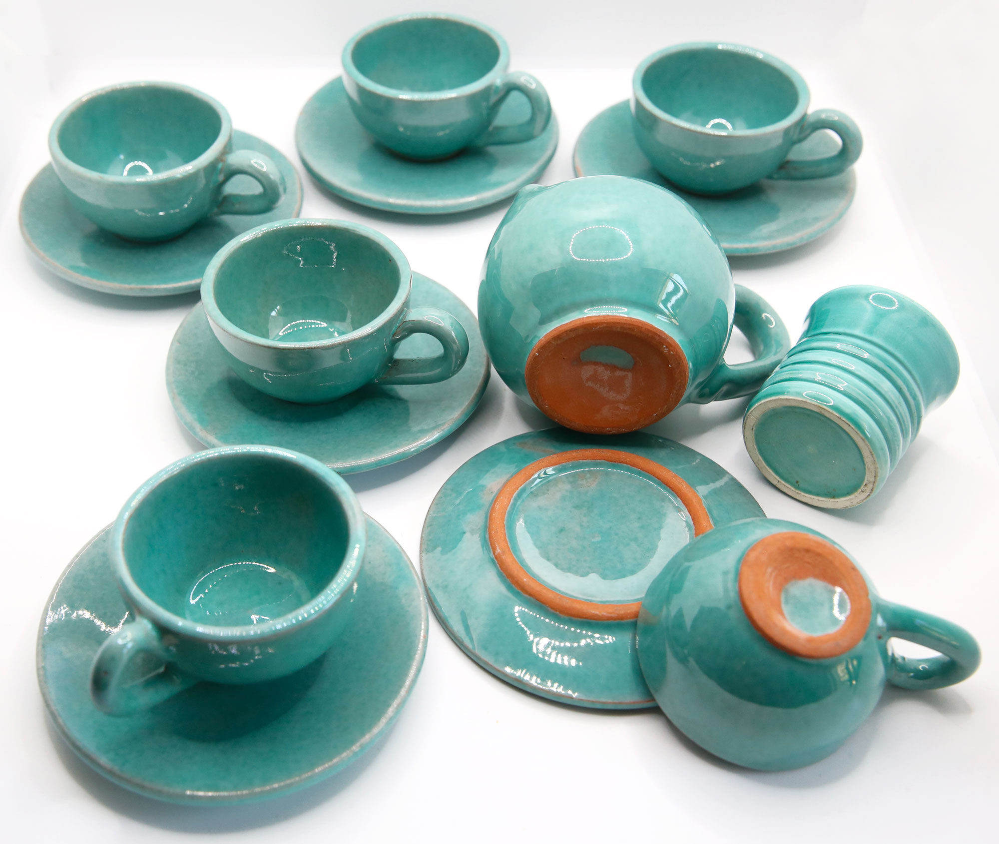 Set of 6 cups in turquoise blue enamelled earth with their saucers and milk jar