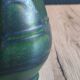 Vintage ceramic pitcher vase in glazed green and blue.
