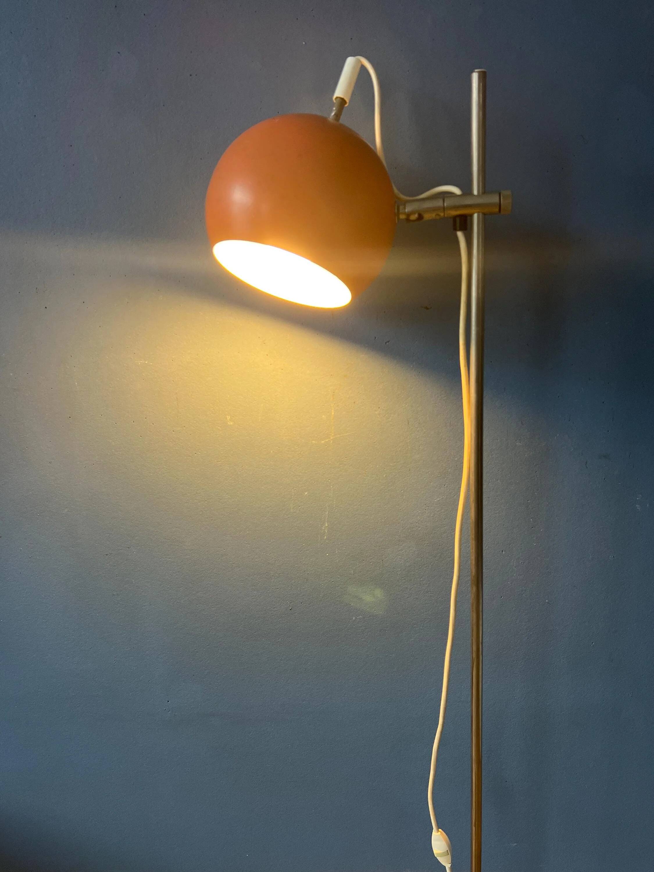 Mid-Century orange floor lamp with "eyeball" shade