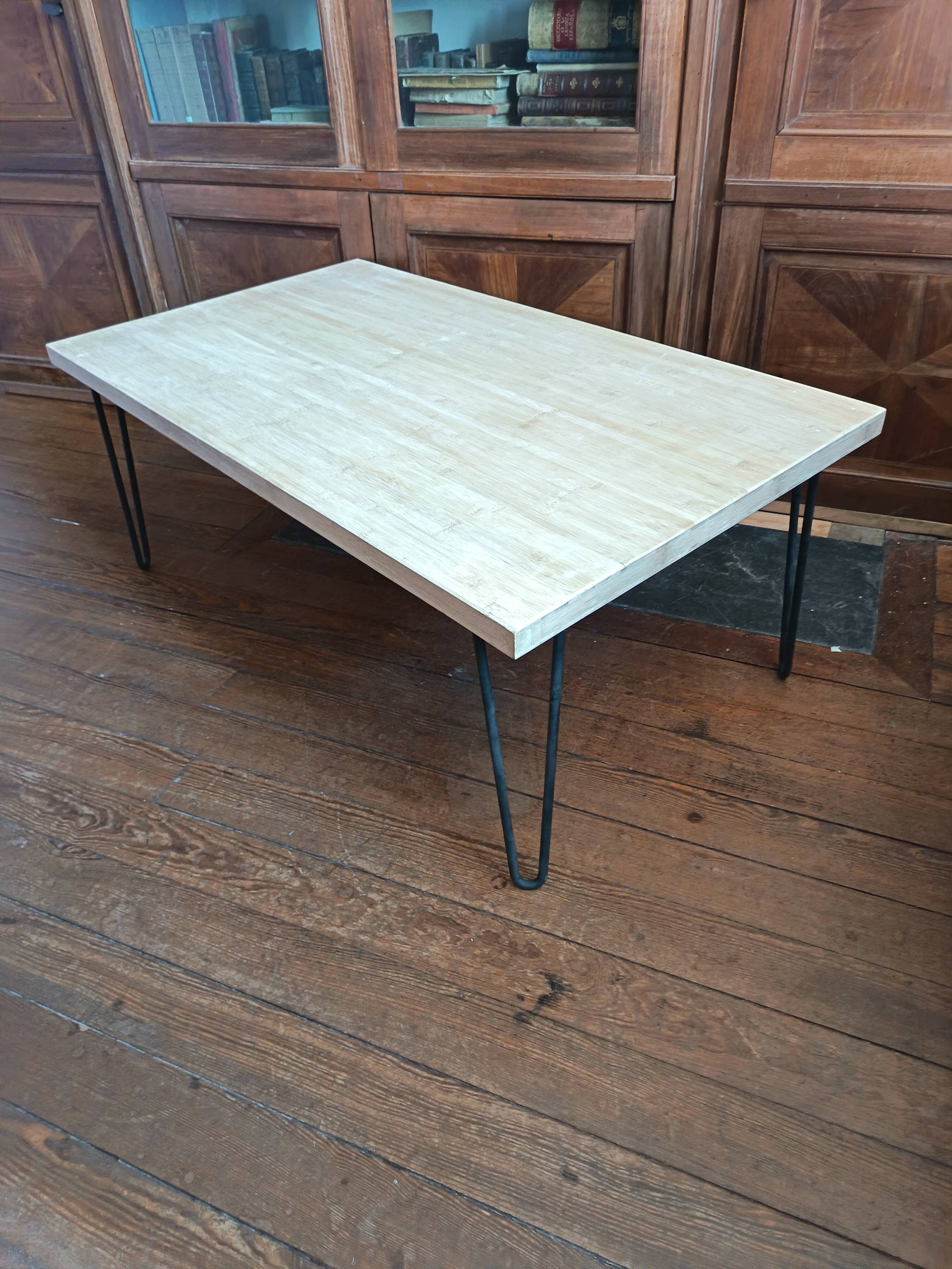 Coffee table in solid bamboo with steel legs.