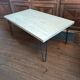 Coffee table in solid bamboo with steel legs.