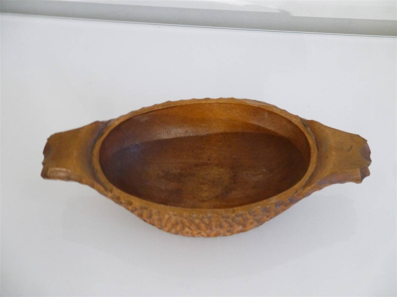 Gouged wooden pocket emptier