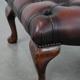 Dark brown chesterfield ottoman in cowhide leather