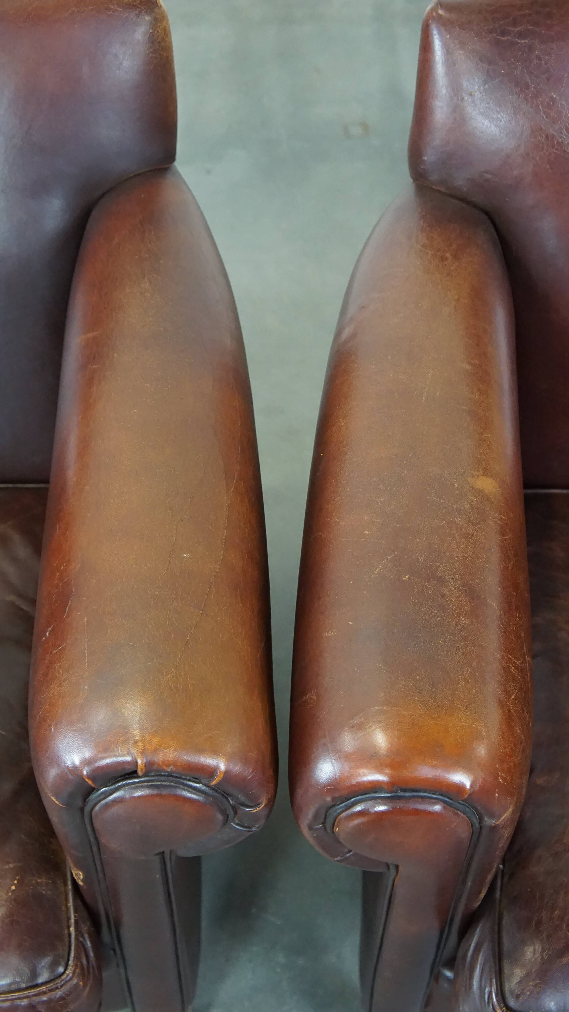 Set of 2 design armchairs made of sheepskin