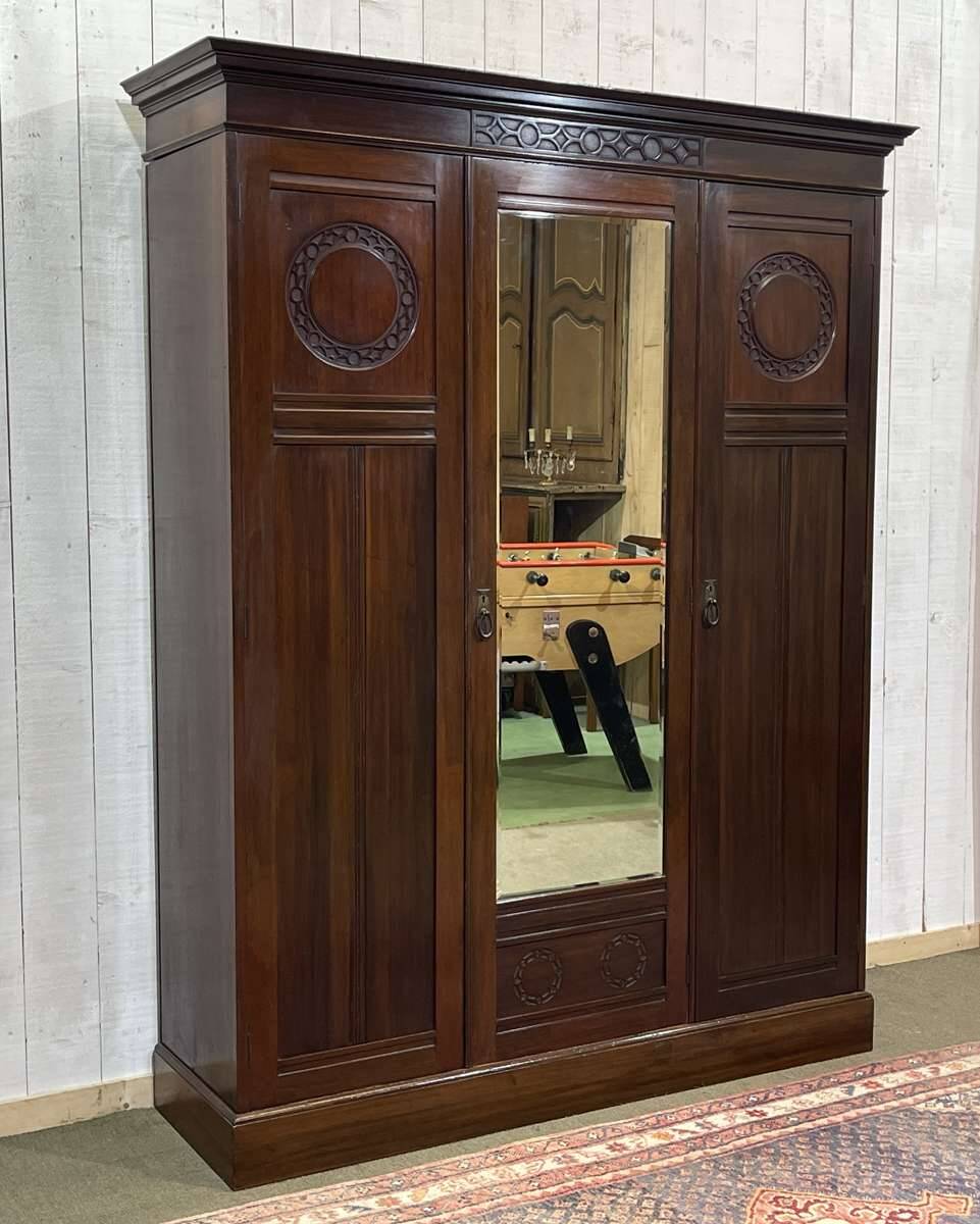 19th-century English mahogany three-door wardrobe.