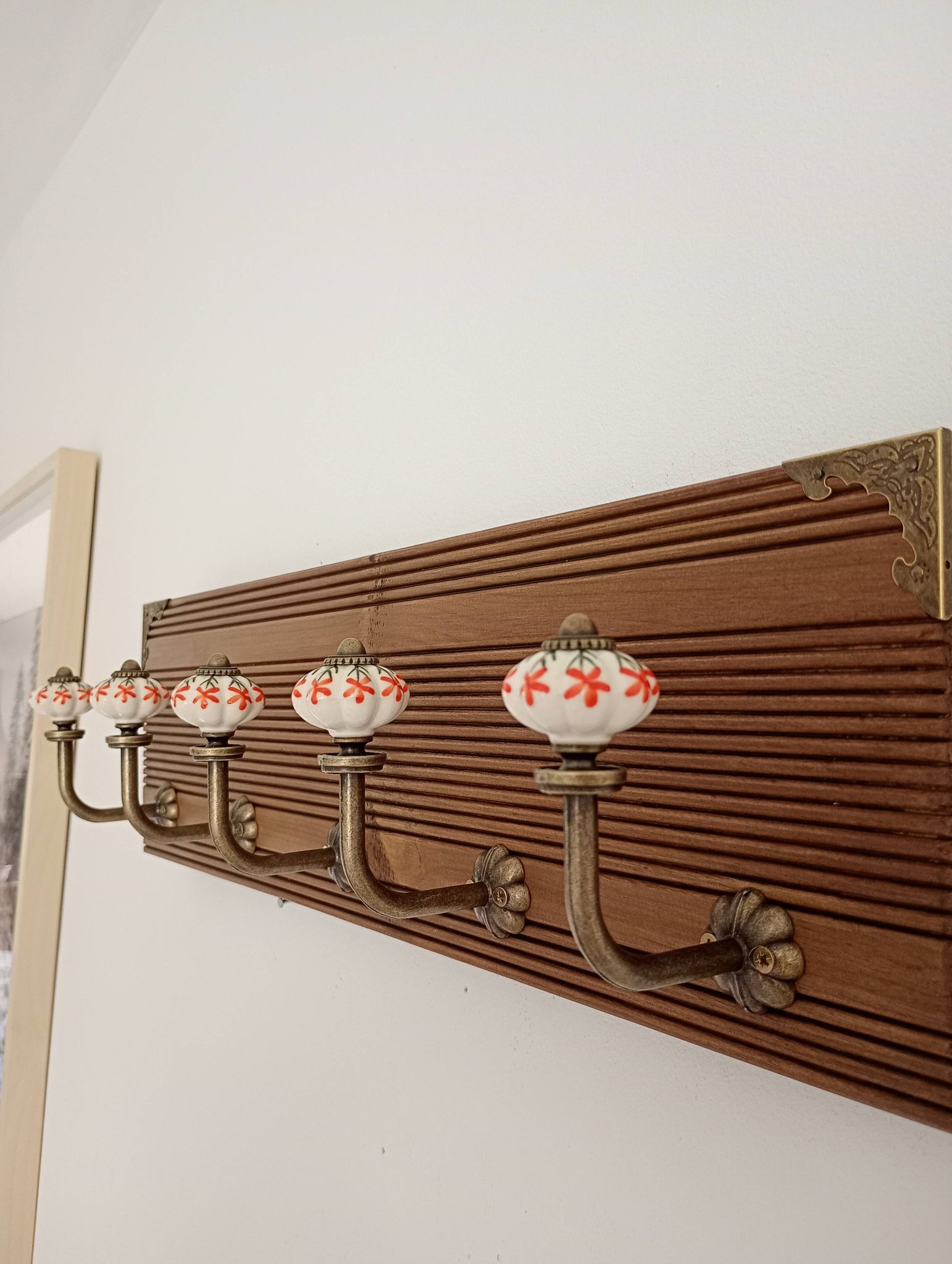 Vintage wall coat rack with 5 ceramic hooks featuring floral patterns - wood