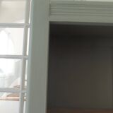 Vintage shallow bookcase re-enchanted in verdigris.