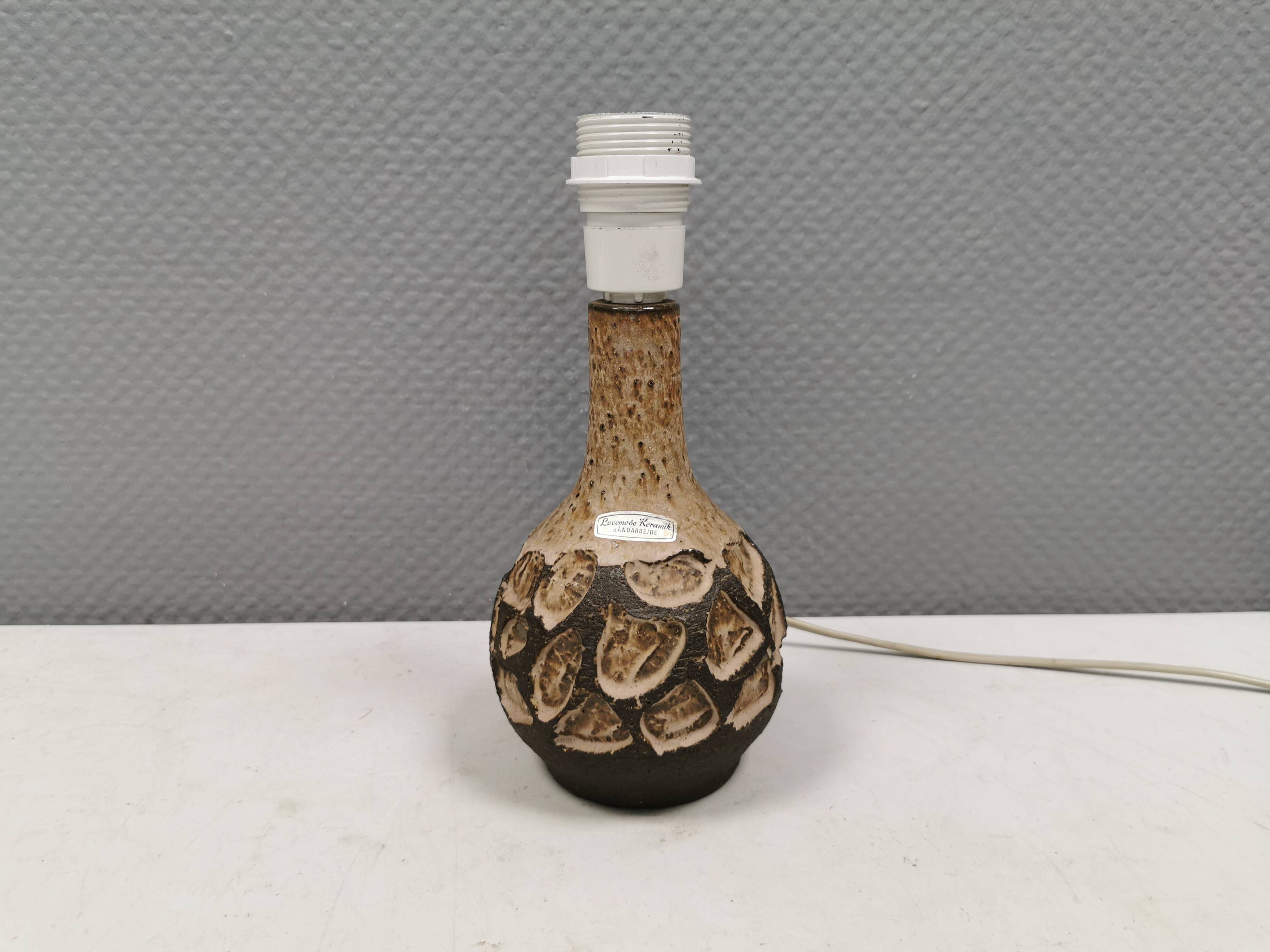 Small beautiful ceramic table lamp in earth colors.