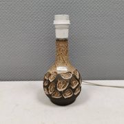 Small beautiful ceramic table lamp in earth colors.