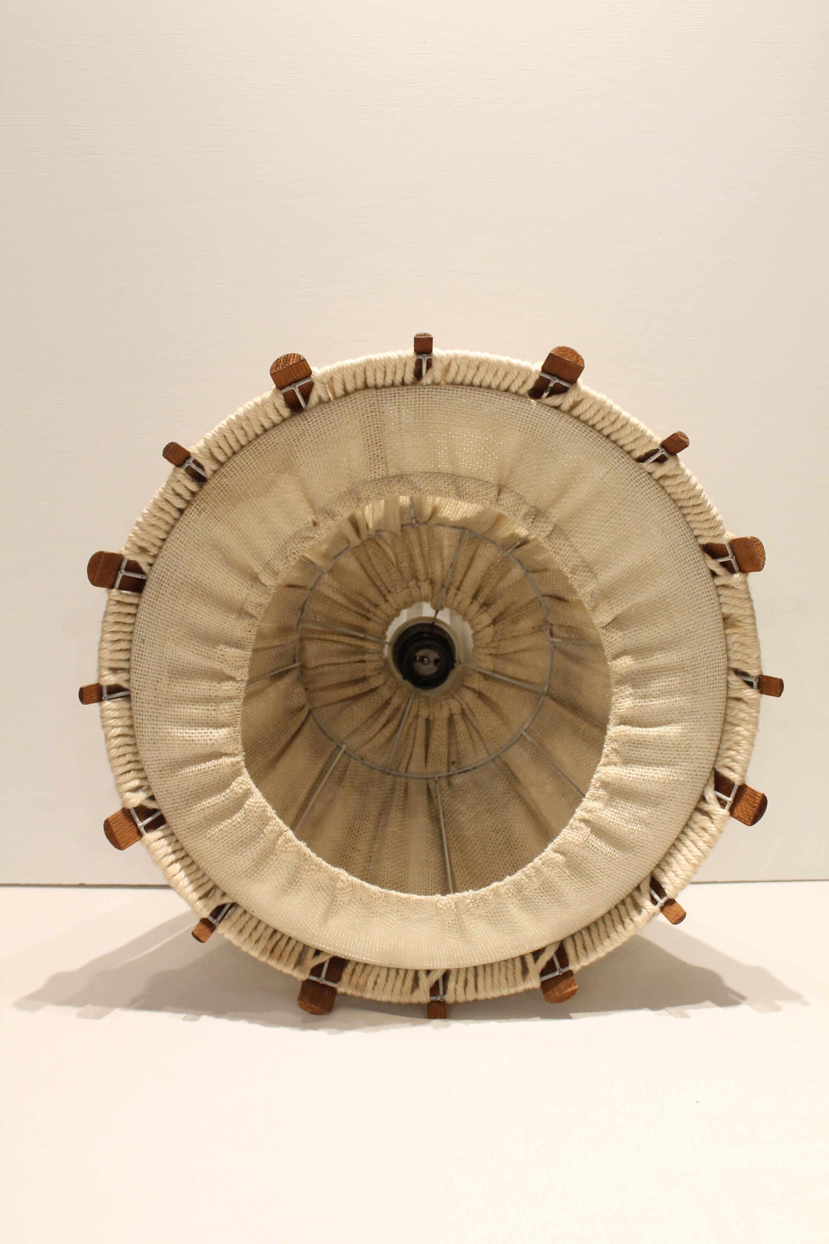 Suspension in teak and textile.