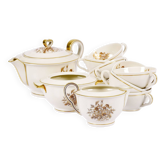 Service de thé en porcelaine de Théodore Haviland, motifs dorés.