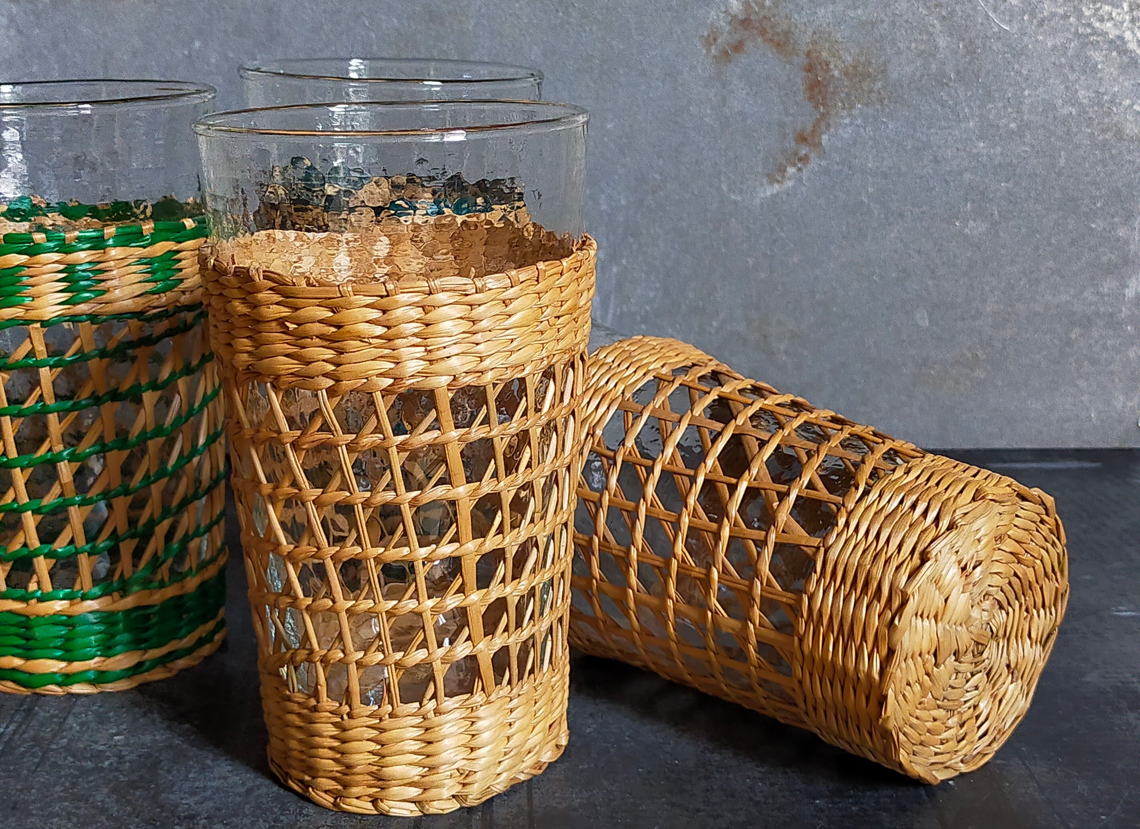 Four long drink glasses in vintage woven rattan cases