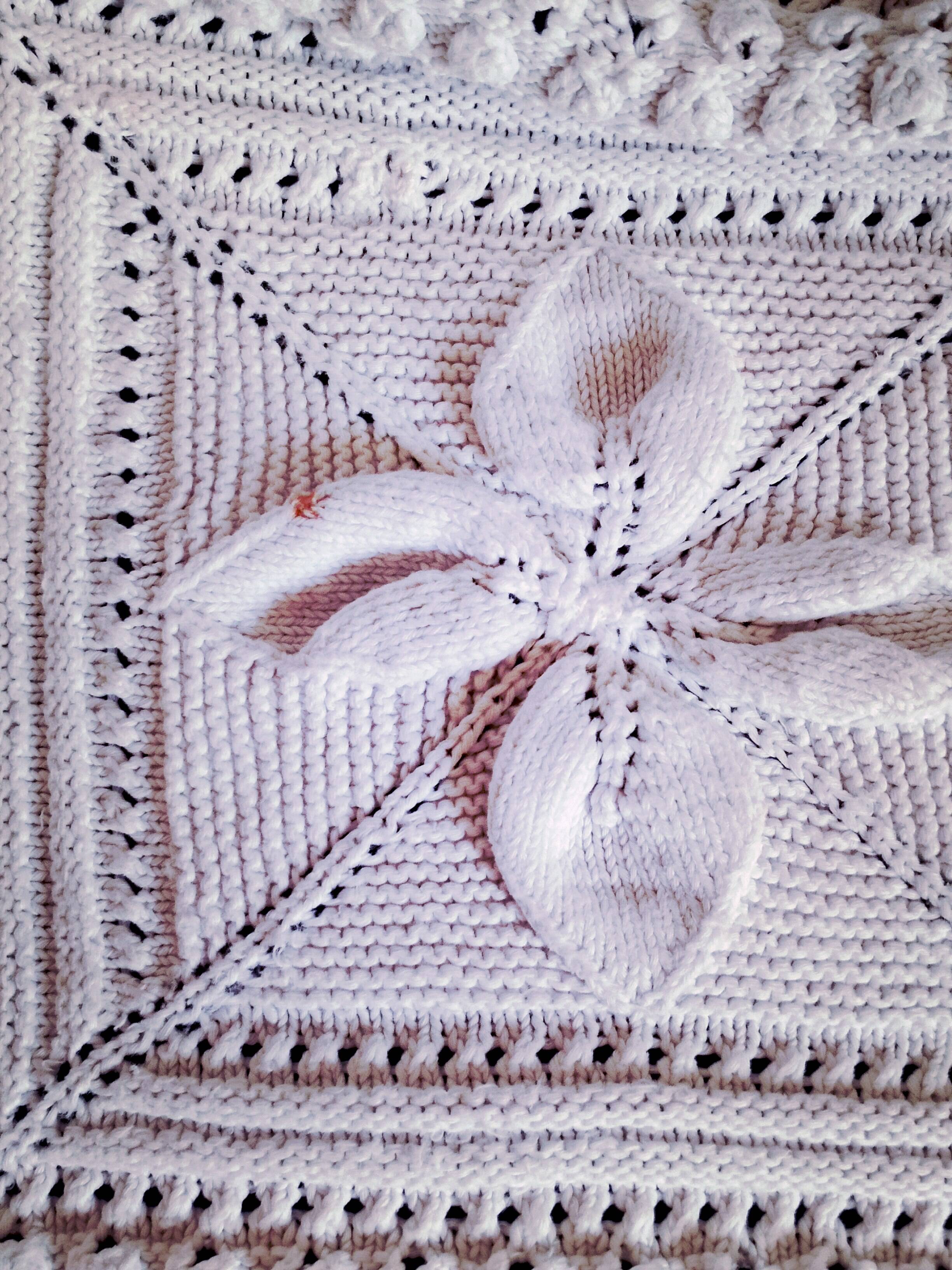 Knitted white cotton bedspread