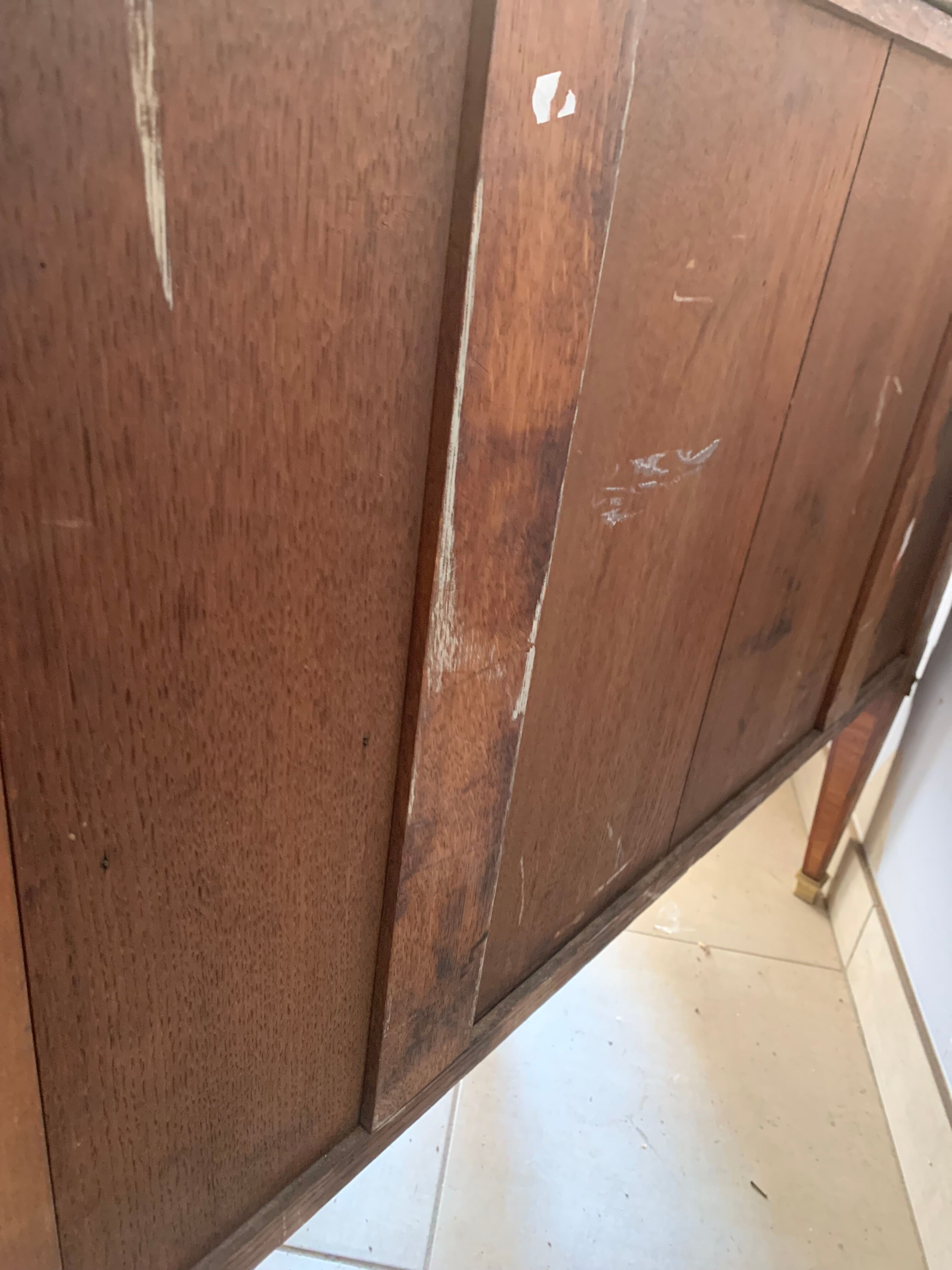 Louis XVI style half-moon chest of drawers in late nineteenth century marquetry