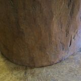 Antique hand carved mortar coffee table with circular glass top