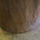Antique hand carved mortar coffee table with circular glass top