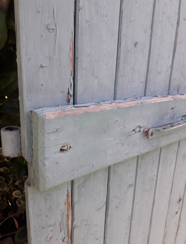 Pair of large wooden iron hanging shutters