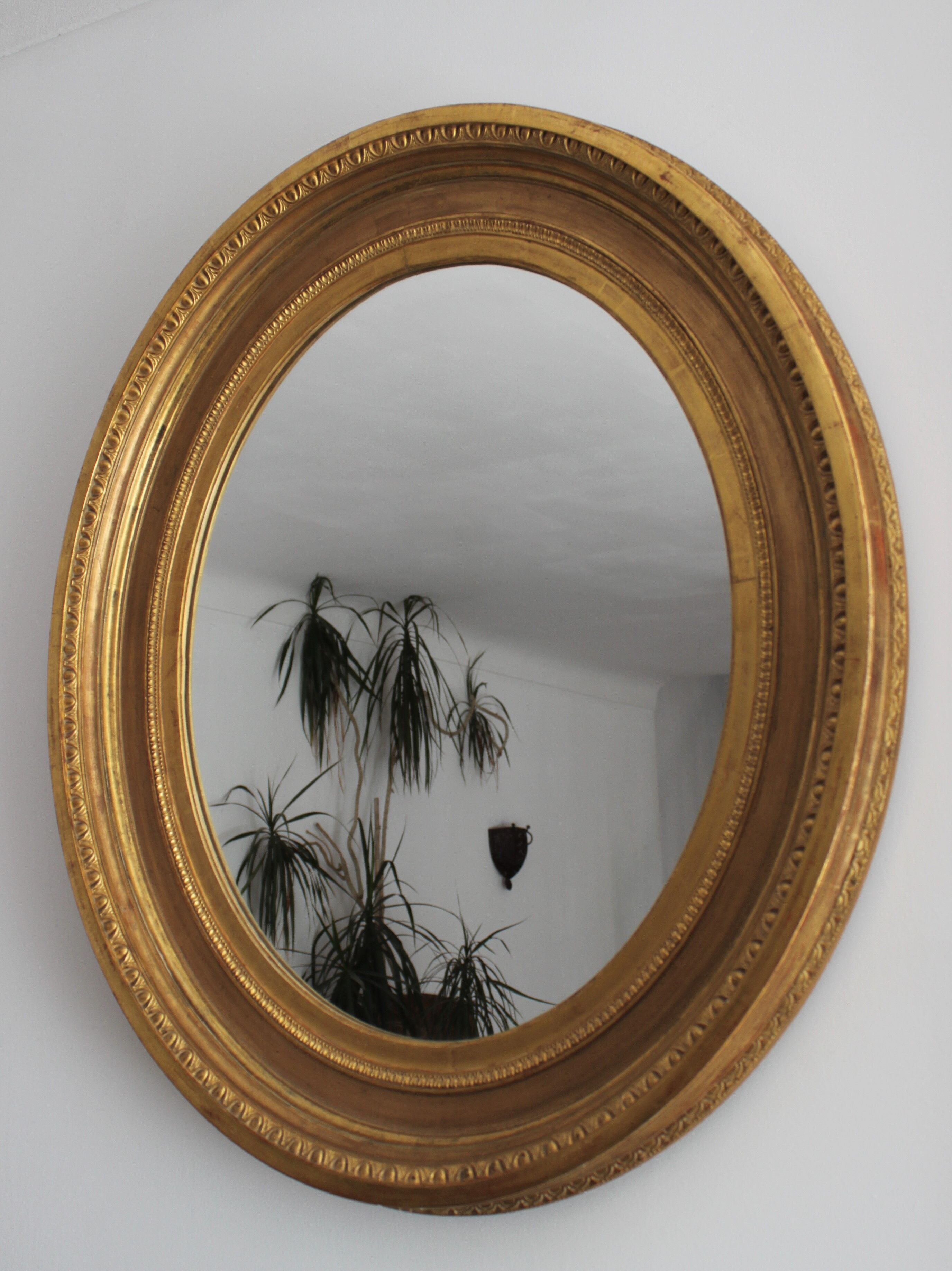 Mirror antique medallion gilded with gold leaf