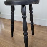 Black wooden tripod stool