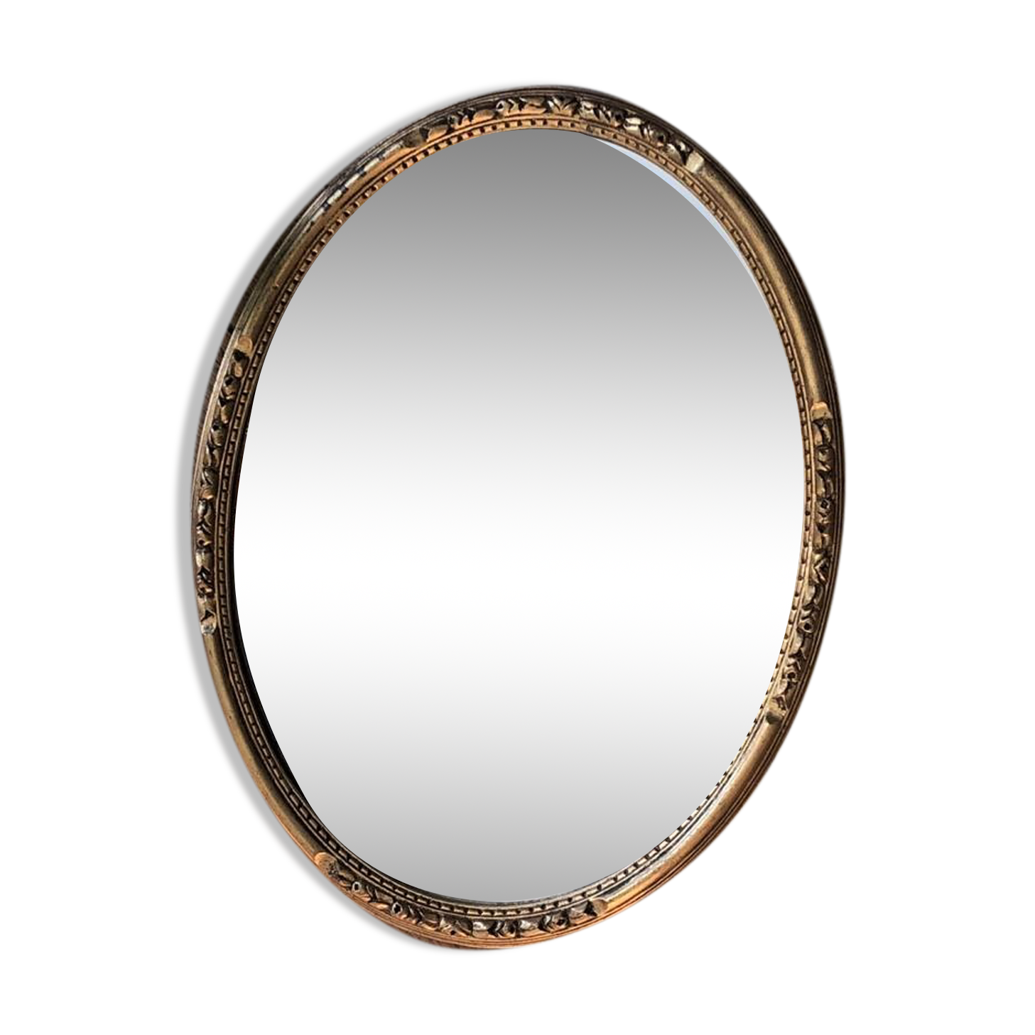 Miroir ovale doré, motif feuillages
