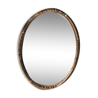 Gilded oval mirror, foliage pattern