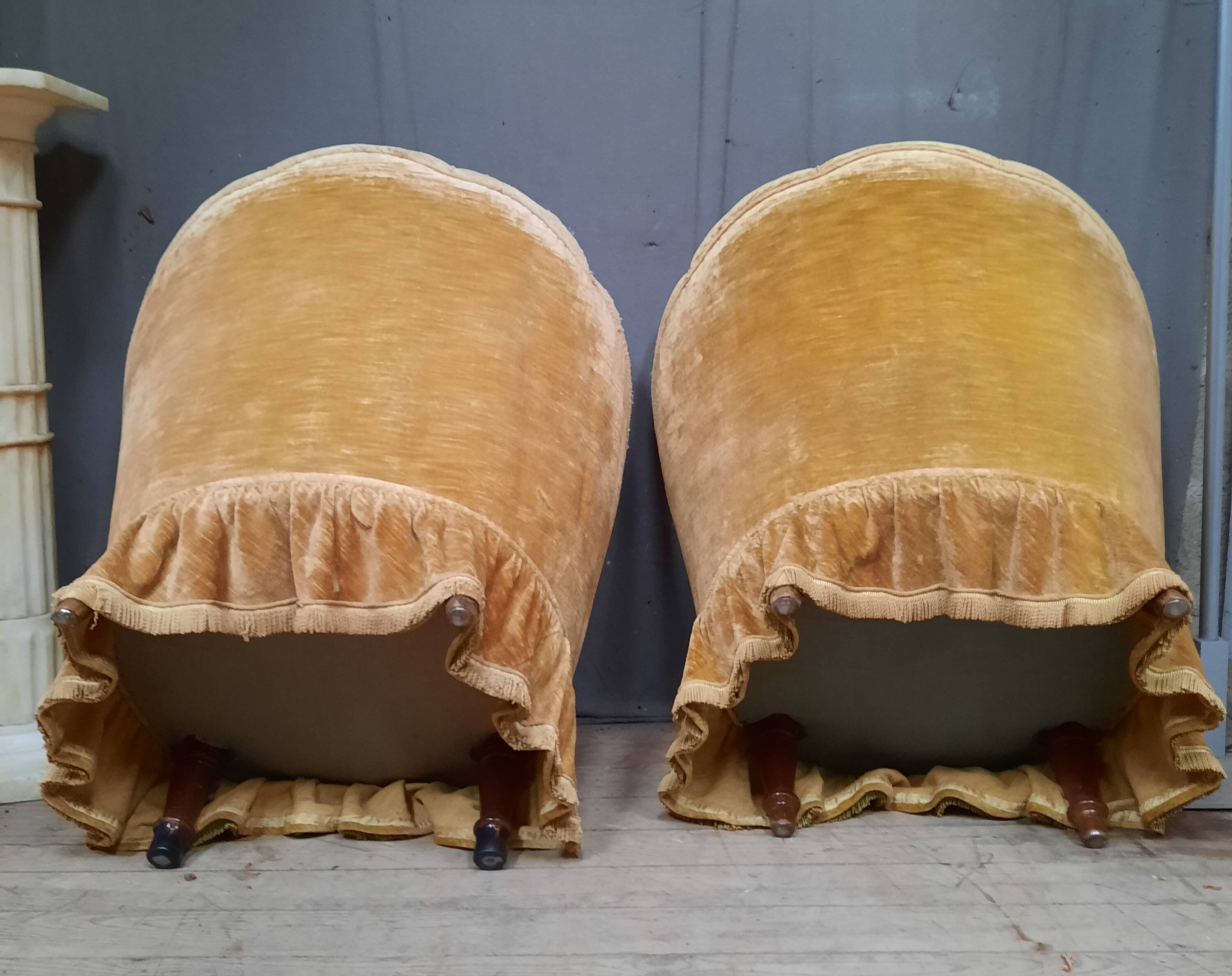 Pair of flared back toad armchairs