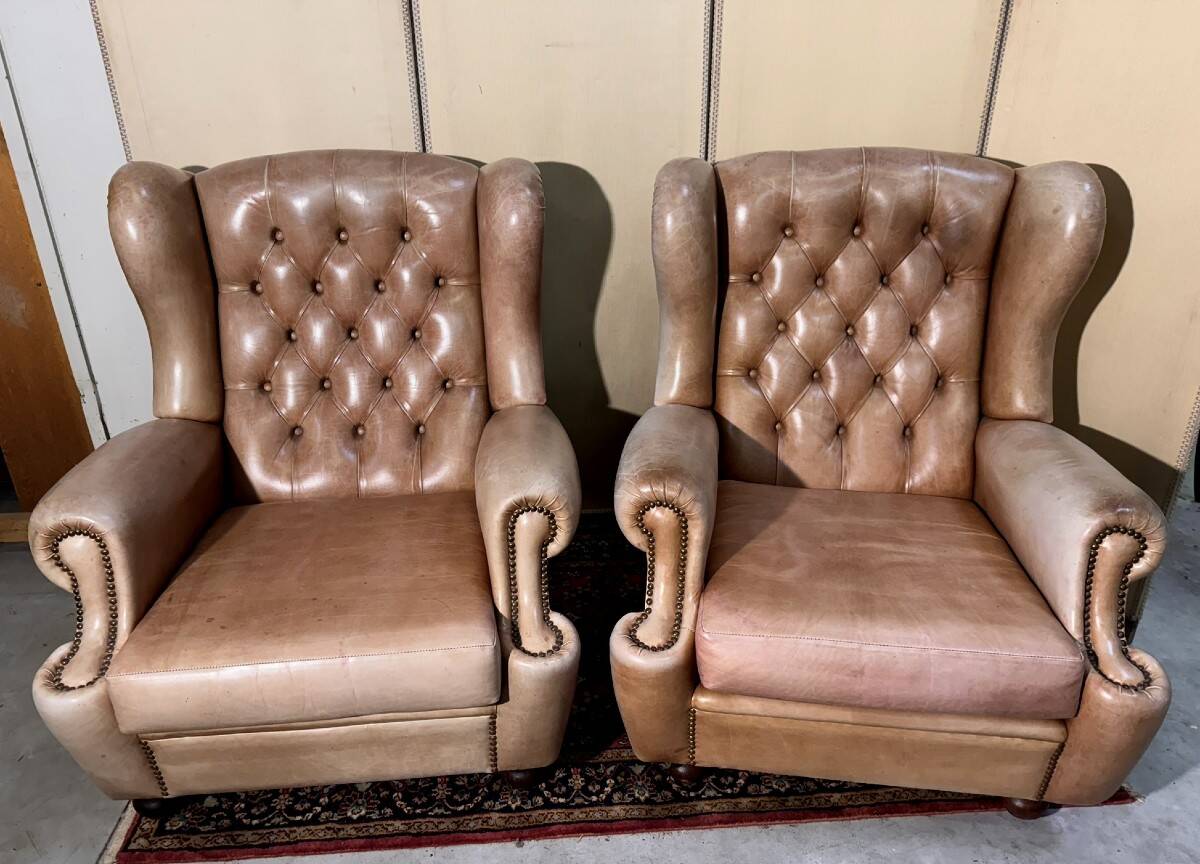 Pair of Chesterfield leather wingback armchairs