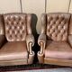Pair of Chesterfield leather wingback armchairs