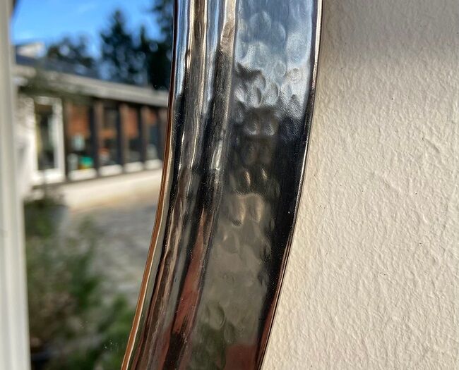 Hammered metal round mirror