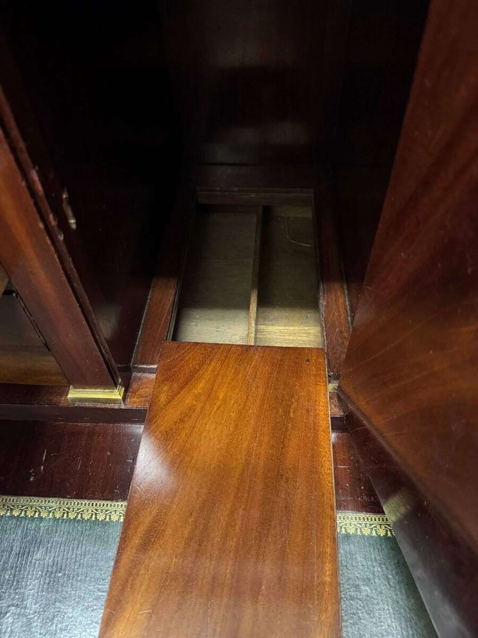 Rare Empire period mahogany secretary with four columns topped with bronze capitals.