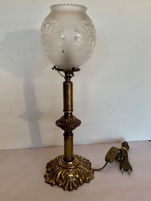 Ancient lamp on foot