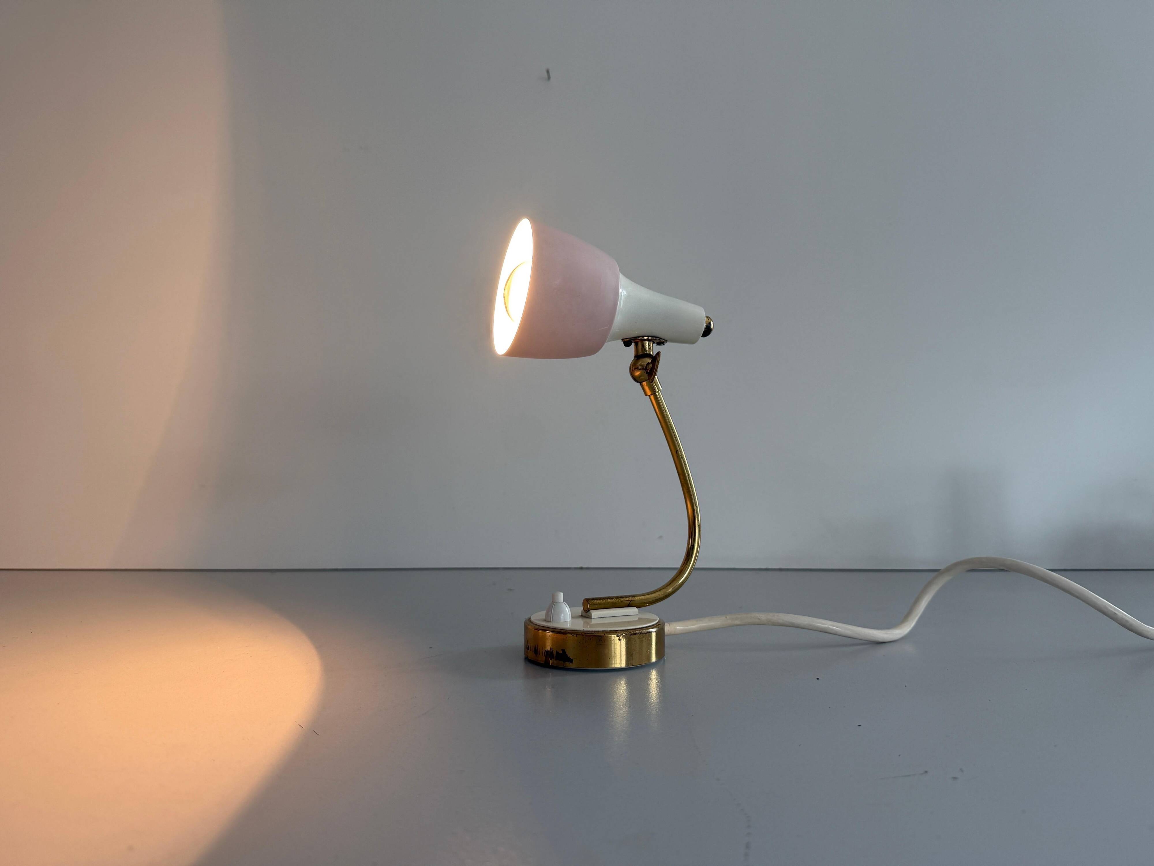 Simple table lamp with a pink metal head and brass body, 1960s, Germany.
