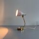 Simple table lamp with a pink metal head and brass body, 1960s, Germany.