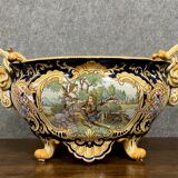 Earthenware planter with polychrome enamelled decoration on a blue background