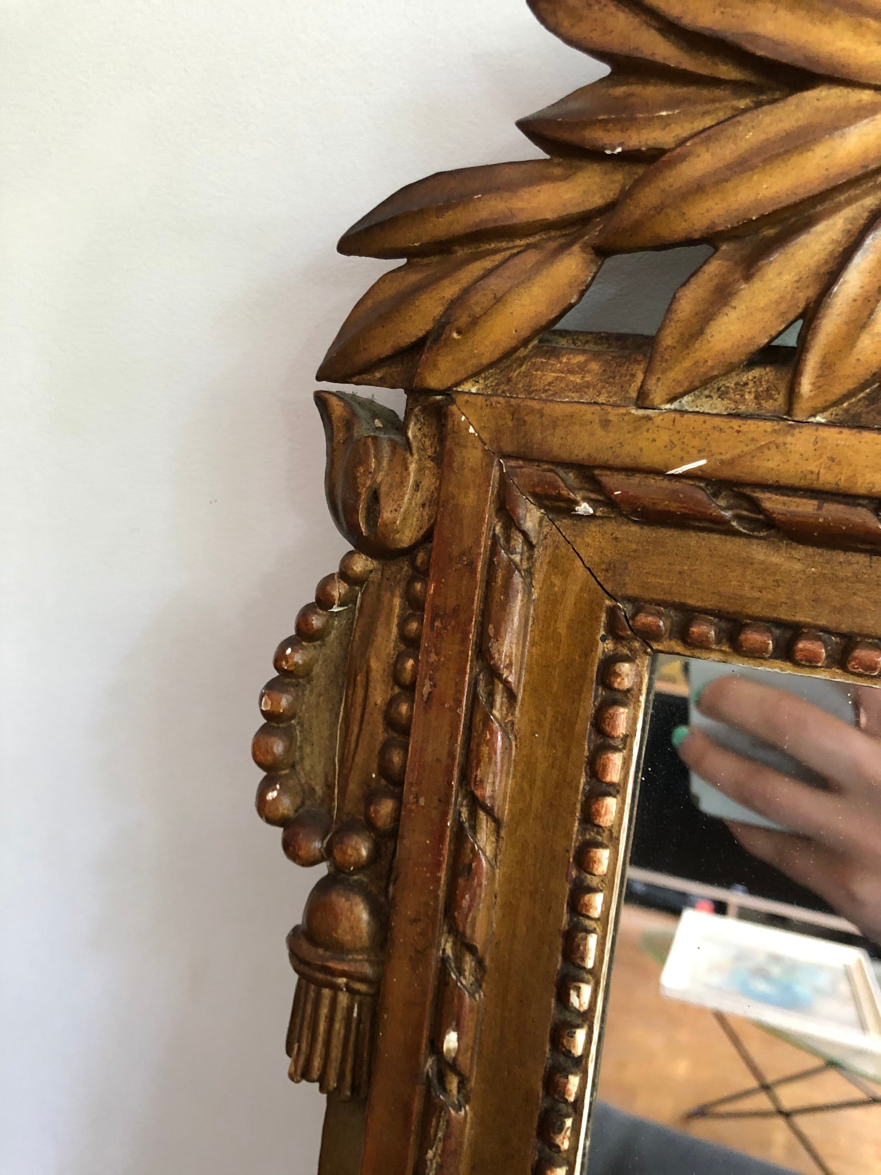 Gilded wooden pediment mirror