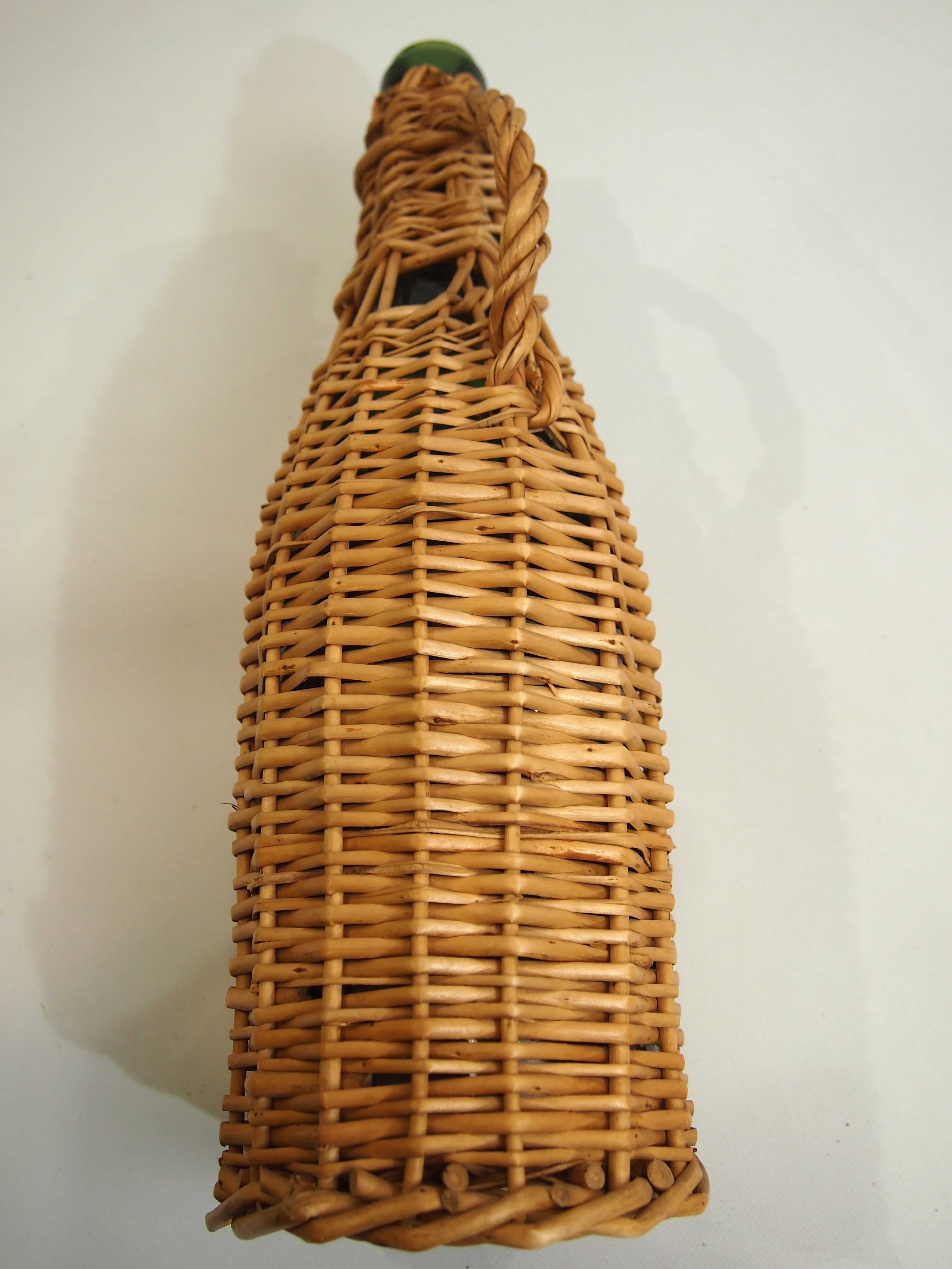 Bottle dressed in rattan