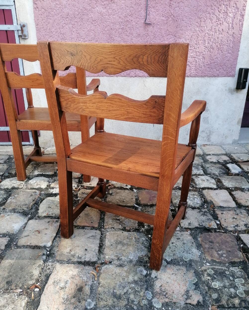 Pair of vintage oak armchairs with geometric design.